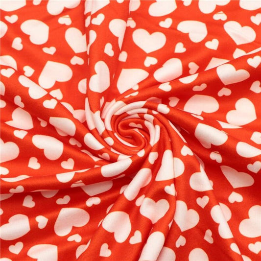 White Hearts on a Red Background Double Brushed Poly Fabric